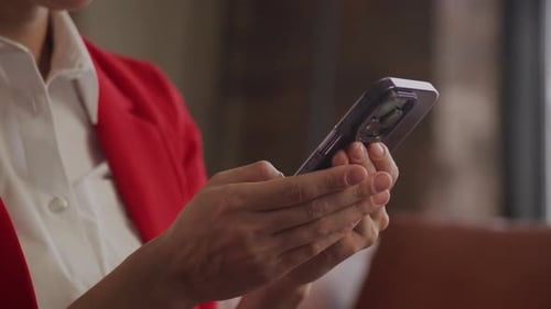 Businesswoman Using Smartphone Close Up in Office