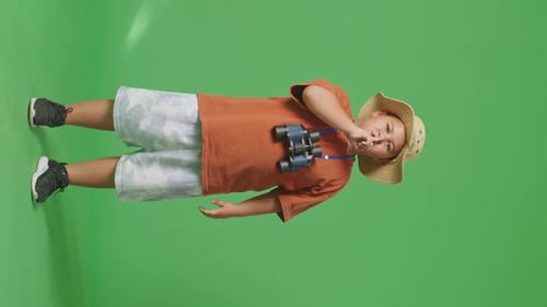Asian Tourist Boy Researcher Making Shh Gesture On The Green Screen Background