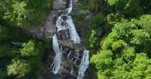 Beautiful Landscape of High Waterfall with Falling Down Clear Water From Rocky Boulders Between
