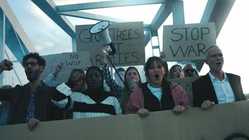 Group of People Protest with Signs in the City