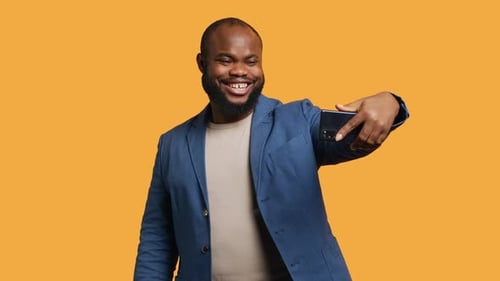 Joyous Man Using Smartphone to Take Selfies Studio Background