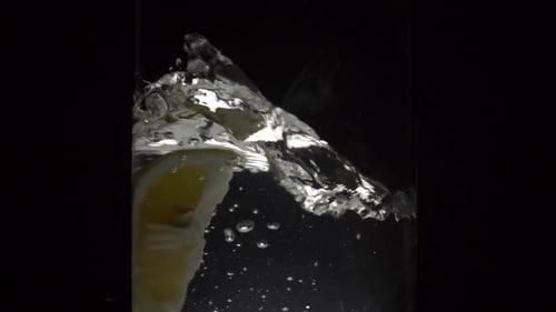 Lemon Slice Drops into Water