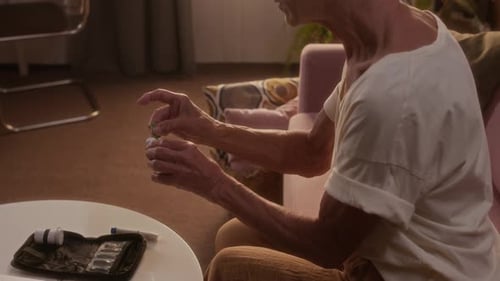 Senior Woman Checks Blood Sugar Levels at Home