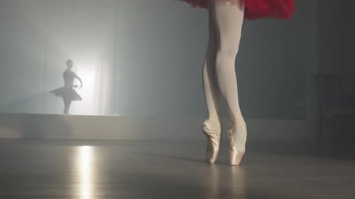 Ballerina Practicing Ballet in Pointe Shoes on Stage