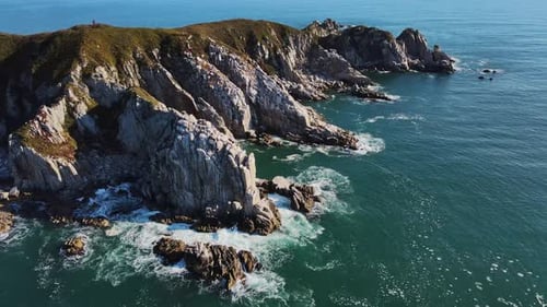 A Stunning Aerial View of a Rocky Cliff By the Ocean