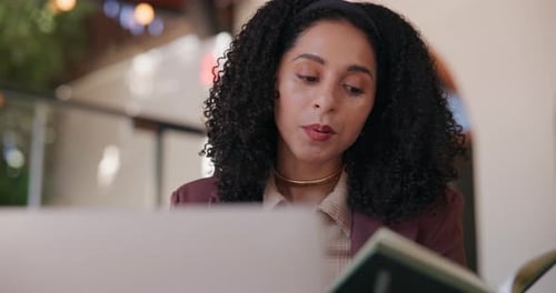 Woman Working at Cafe on Laptop Computer