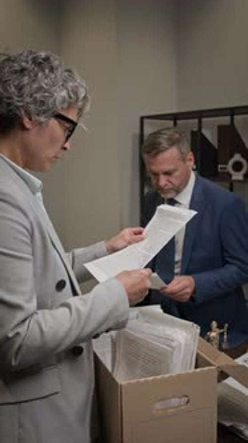 Business People Working Together with Documents in Office