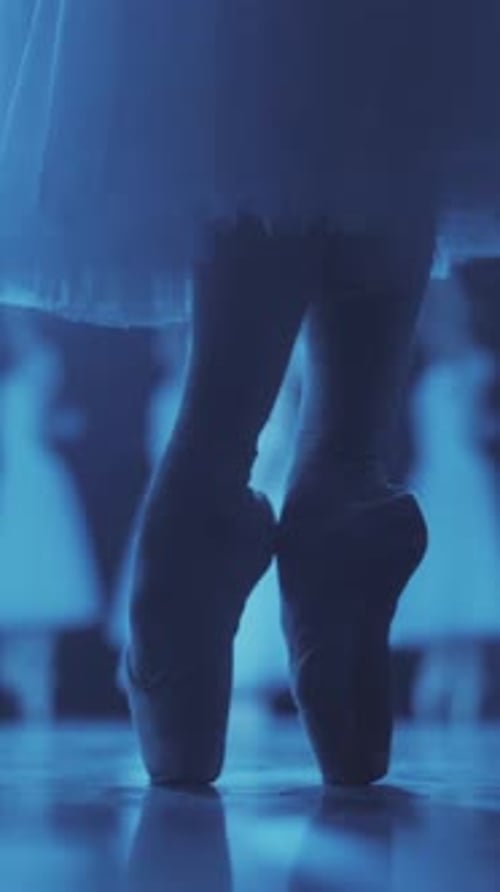Ballerina Practices Pointe in a Blue Lit Dance Studio