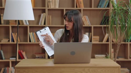 Woman Explaining Charts During Video Conference Call