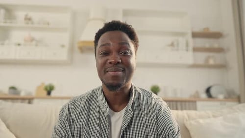 Smiling Man Talking on a Video Call