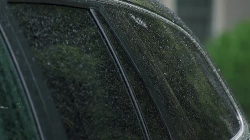 Close Up Slow Motion View Heavy Rain Water Drops Storm Rain Falls on the Car Window