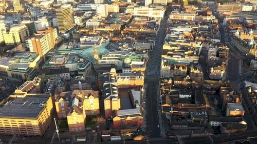 Aerial drone footage of the town centre of Leeds in West Yorkshire UK, showing the whole of the Leed