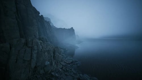 Misty Shoreline Creates a Serene Atmosphere at Dawn Near a Tranquil Lake