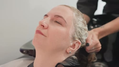 Woman Getting Hair Washed at a Salon