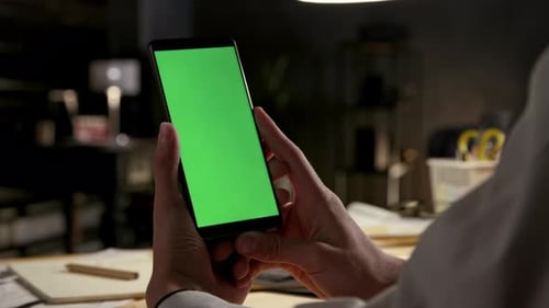 Green Screen and Chroma Key of Smartphone. Business Male Holds Smart Phone