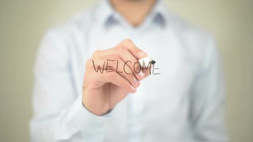 Welcome Message Written on Transparent Surface