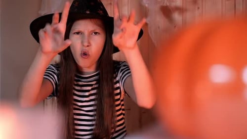 Teen Dressed as Witch Casting Spell