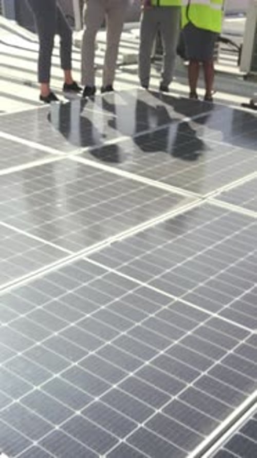 City, architecture and people with blueprint, talking and property development with renewable