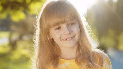 Portrait of Happy Preteen Child Girl Face Smiling Looking at Camera Good Mood Satisfied on Park