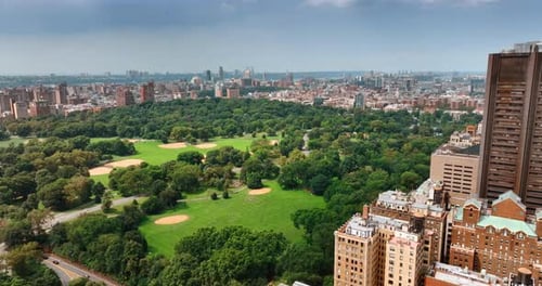 Flying above the territory of the Central Park in New York on sunny afternoon.