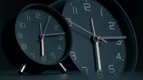 A Display of Stylish Black Analog Clocks Showcases Their Elegance and Design Beautifully