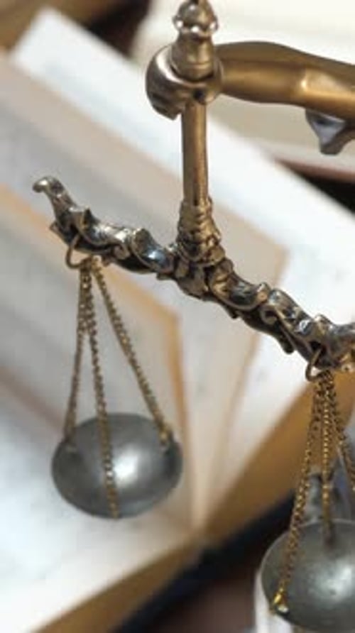 Unrecognizable Lawyer's Hand Works with Papers and Law Books