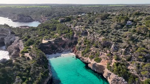 Amazing beach between cliffs on Mallorca with crystal clear blue water Caló del Moro