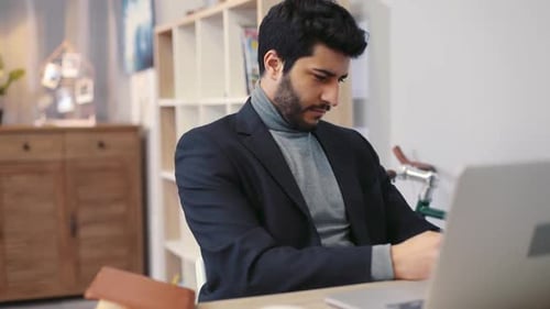 Close Up View of Attractive Young Man Carefully Rereading Proofreading Editing the Documents Working
