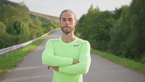Confident Healthy Strong Man Athlete Running in Countryside Outside Standing on Road and Crossing