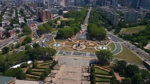 An aerial view from over the museum of art on a sunny day. The camera dolly in, truck left showing t