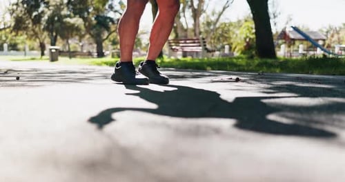 Legs, fitness and skipping at park with workout for wellness, balance and weight loss with summer