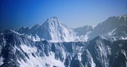 Aerial Flight Over Majestic Snow-Capped Mountain Range