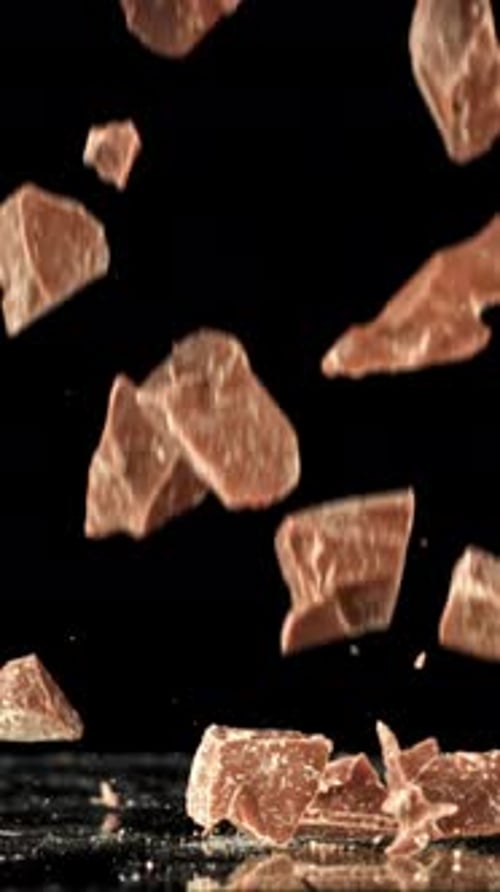 Super Slow Motion Pieces of Dark Milk Chocolate Filmed on a Highspeed Camera at 1000 Fps