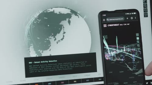 Cyber Threat Map and Code on Computer Screens