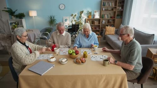 Seniors Play Bingo Together at Cozy Home