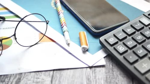Financial Graph Calculator and Notepad on Table