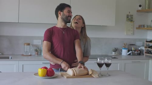 Loving Couple Cooking Together in Modern Kitchen