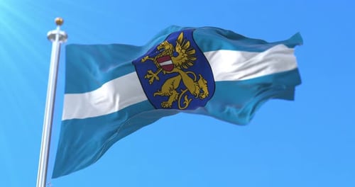 Realistic Waving Flag with Coat of Arms on Blue Sky