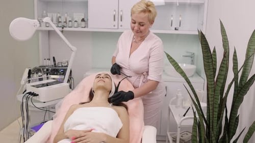 Woman Receives Facial Treatment at Medical Spa