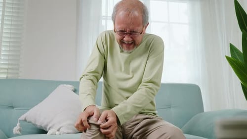 Senior Man Having Painful Knee Pain After Ligament Surgery