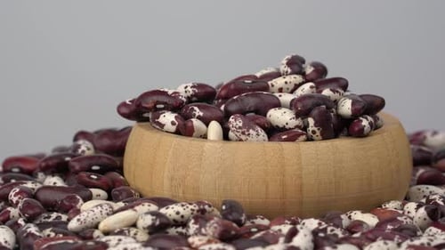 Wooden Bowl Filled with Burgundy Speckled Beans