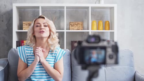 Blonde Woman Vlogging on Couch in Home