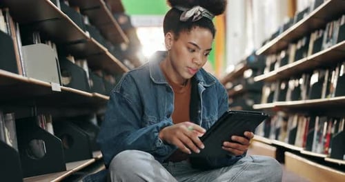 University, student and thinking with tablet in campus library for ebook study or online course