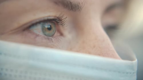 Close-Up Portrait of Modern Casual Young One Woman Wearing Protective Medical Face