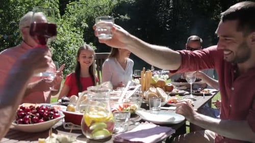 Family outdoor celebration at backyard dinner table