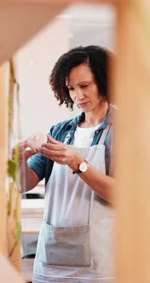 Inspection, product and small business with woman in boutique for retail commerce or display