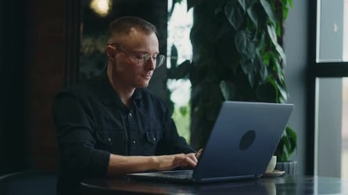 Programmer Freelancer Working Online In Cafe Remote Job For HighSkilled IT Specialist Portrait