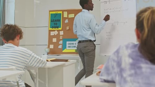 Coding Class with Students in Modern Classroom