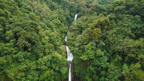 La Paz Waterfall cascading through dense rainforest in Costa Rica