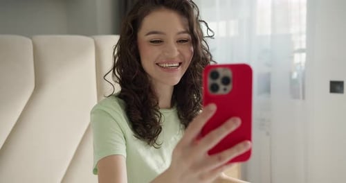 Woman Chatting on a Video Call Using Phone